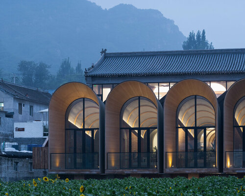 sculptural and rhythmic, these arched concrete volumes enliven the chinese countryside