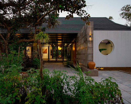 cement blocks and iron lattice enclose private courtyard in rural vietnam