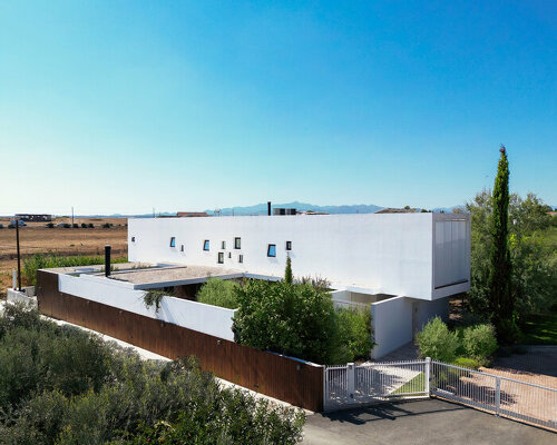 residence unfolds around internal courtyards in cypriot barren landscape