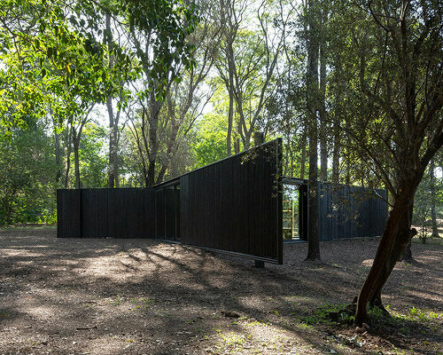 triangular 'archipelago pavilion' designed for flexible use in woods of argentina