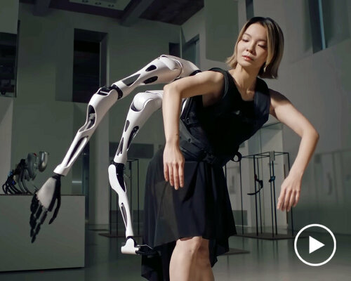 wearable robot arms that move like spider legs prepare human interaction with cyborgs