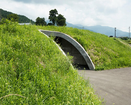 furuya design weaves underground sake brewery into the lush landscape of fukui, japan