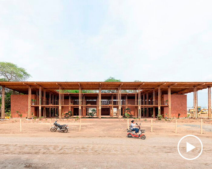 round teak wooden posts uphold natura futura's community center in ecuador