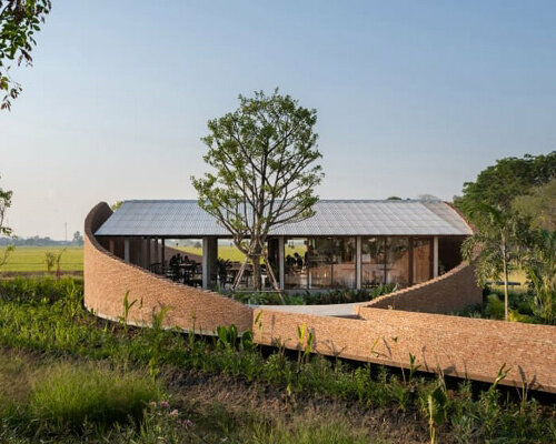 bodinchapa architects integrates naya cafe into the ever-changing rice fields in thailand