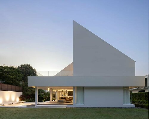 austere geometric volumes compose white 'rupu house' in bangkok