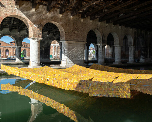 serge attukwei clottey hangs tapestry of plastic gallon containers at the venice biennale