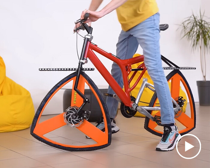 who said wheels have to be round? this triangle-wheeled bike is just as functional