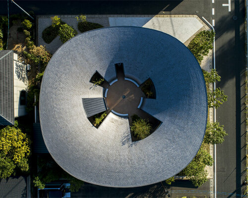 NKS2 architects crowns japanese dwelling with a large, vessel-shaped roof