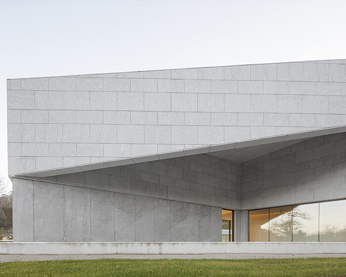 a folded stone roof crowns this visitor center in the spanish hillside