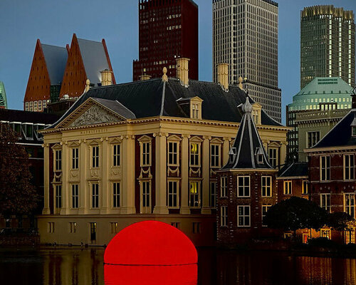 'sunset' installation in delft emerges from the water to emit a vibrant, 360 degree glow 