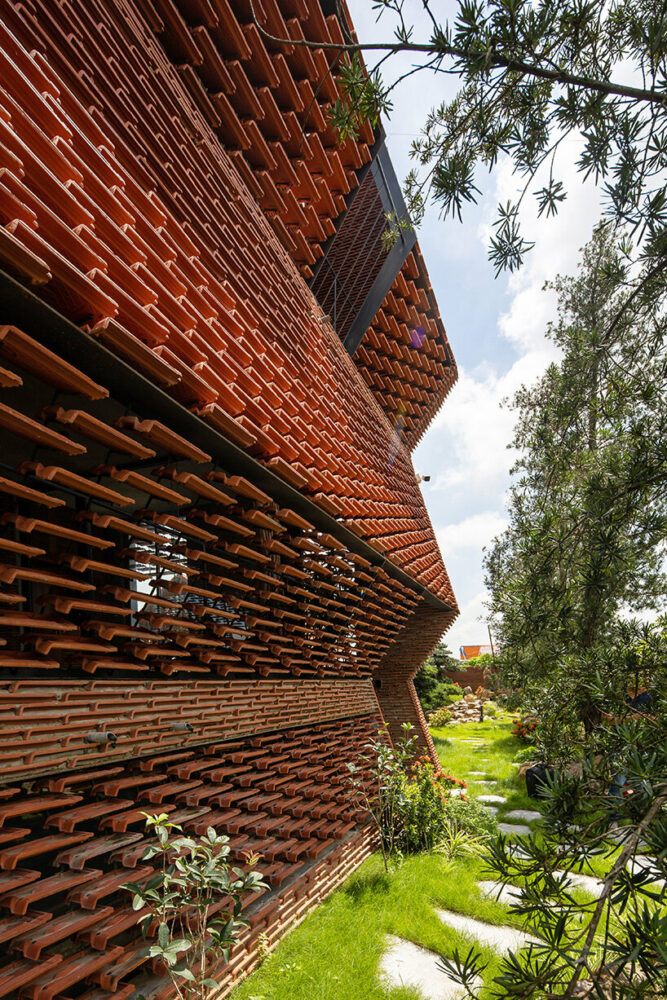 'tile nest' unveiled as a nature-infused porous dwelling in vietnam