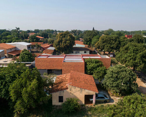 VU4B house composes minimal geometric brick-built volumes in paraguay