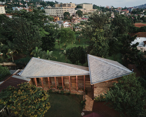 rammed earth, brick, and sandstone compose '32° east arts centre' in kampala, uganda