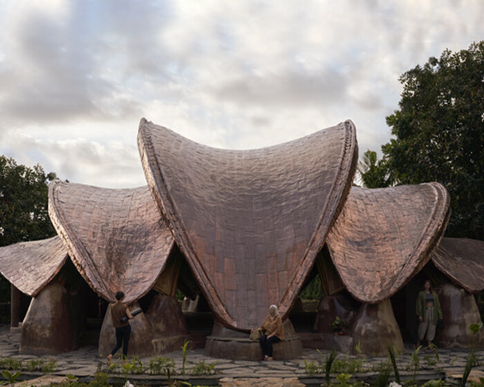 IBUKU's alchemy yoga center unfolds as two sculptural, copper-clad bamboo shalas in bali