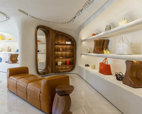 wooden tones + sweeping curves captivate shoppers inside bottega veneta's st tropez store