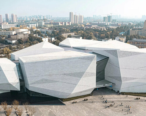 chengdu museum of natural history resembles a monolithic landform of perforated granite