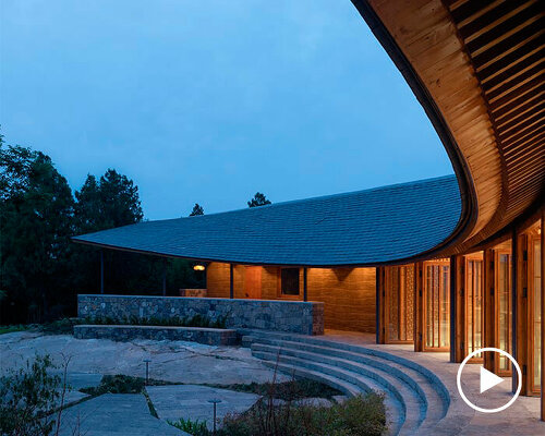 restaurant's gentle curvilinear form encompasses ancient temple in china