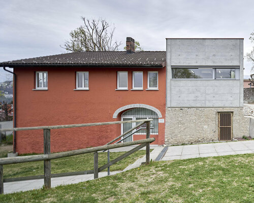 a contemporary addition plugs onto enrico sassi's 'casa rossa' in the swiss alps