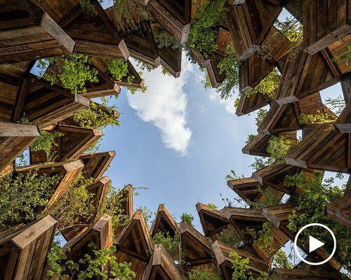 hello wood stacks triangular lush planters for the garden of communities installation