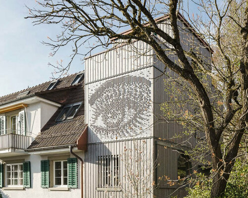 rounded openings and programmed 3D relief punctuate wooden home extension in zurich