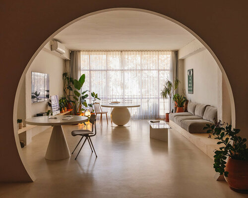 isern serra frames an artist's loft with circular portals in barcelona