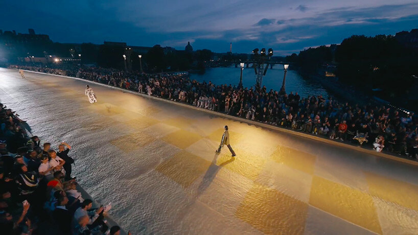 pharrell williams debuts first louis vuitton men's collection against a  checkered gold backdrop