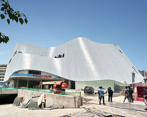 sheer white, fluid facade envelops MAD architects' near-complete concert hall in beijing