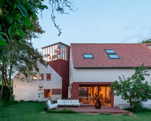 objekt architecten exposes red brickwork on renovated farmhouse's facade in belgium