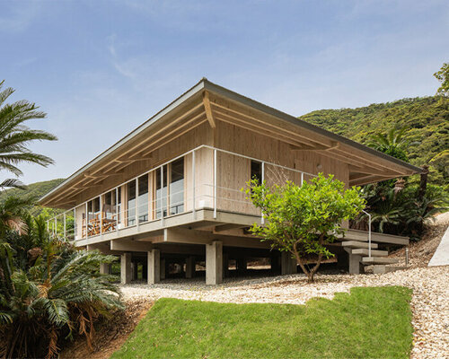 on a secluded japanese hill, ryosuke ono nestles a stilted rental villa with a panoramic porch