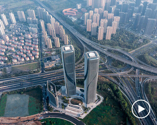 curvilinear patterns cover the glass and aluminum facades of twin towers in china