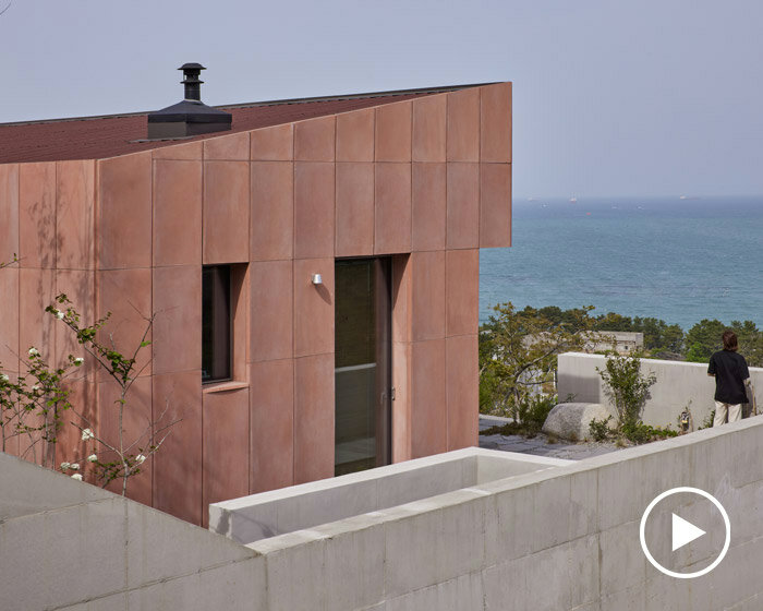 fluted, pink concrete tiles wrap studio weave's seosaeng house in korea