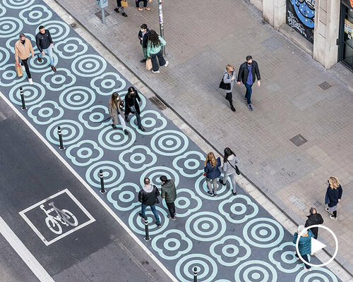 a graphic intervention transforms streets of barcelona for a more inclusive cityscape