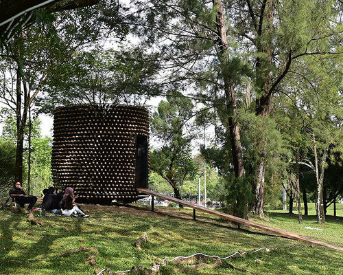 an ensemble of broomsticks shape this architectural sculpture in malaysia