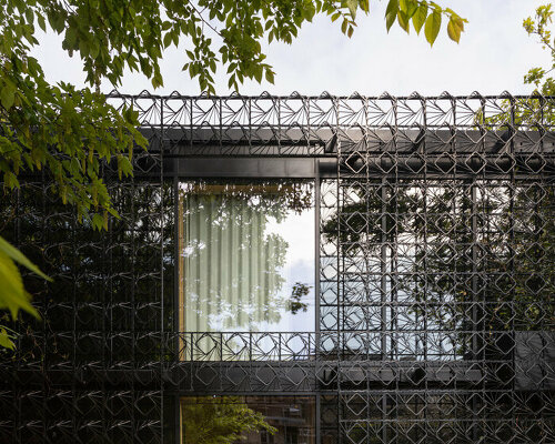 an intricate facade of 'woven' steel promotes a picturesque climbing garden in england