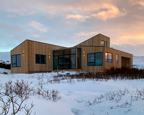 'ylja' retreat in iceland outlines a cluster of solid timber volumes