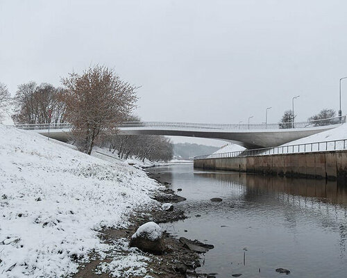 winding pedestrian 'bridge-plaza' converges historic lithuanian city center with public park