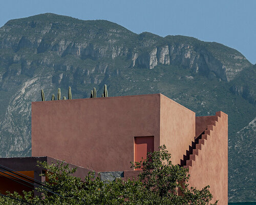 all-red casa ederlezi in mexico pairs bold volumetry with mediterranean tones