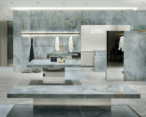 curiosity sculpts a blue labyrinth of onyx slabs within m-i-d's concept store in kobe