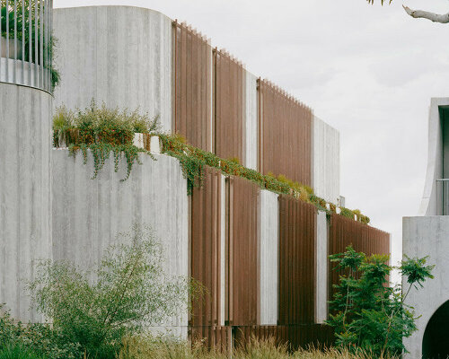 edition office balances heavy concrete fenwick homes with delicate copper screens