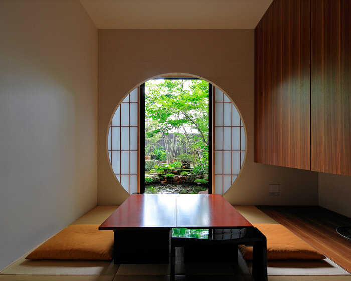 open courtyards embed natural greenery within the living spaces of residence in japan