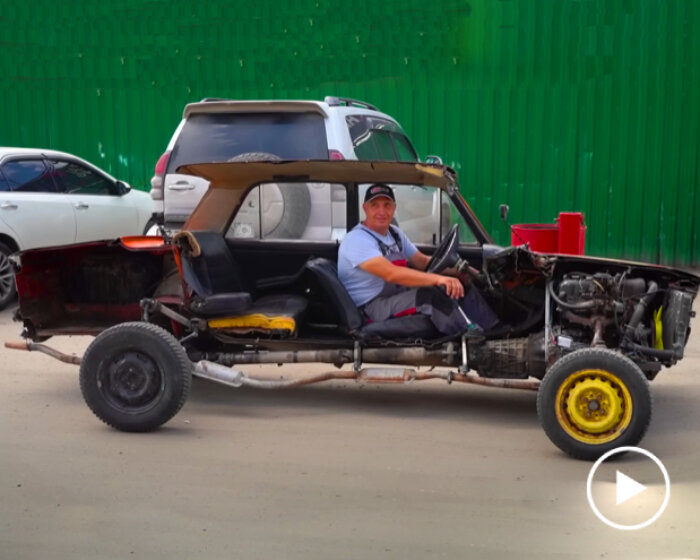 vintage car cut vertically in half fully functions as street vehicle with exposed parts & interior