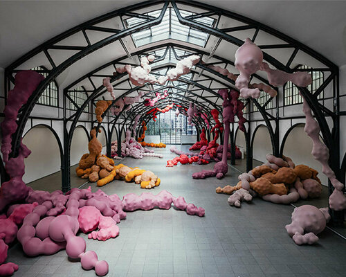 inflated organ sculptures by eva fàbregas grow out of metal beams at hamburger bahnhof