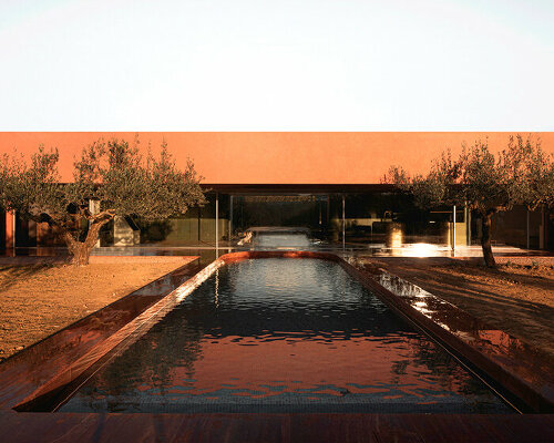 balzar arquitectos plants valencian residence's red steel volume in an olive grove