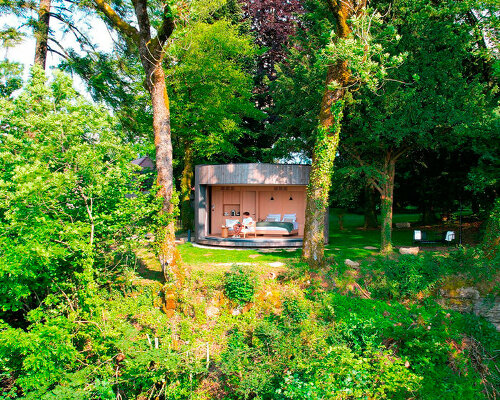 lumipod 6 takes shape as rounded wooden hotel cabin in the french countryside