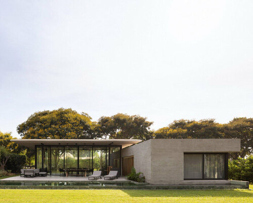 thin reinforced concrete sheet hovers above the glazed living room of house jp in argentina