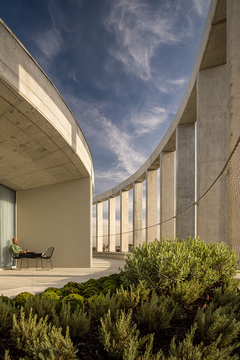 rhythmic concrete pillars wrap around OODA's student housing