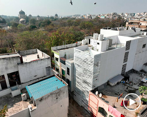 folded steel ribbons envelope narrow row house in india