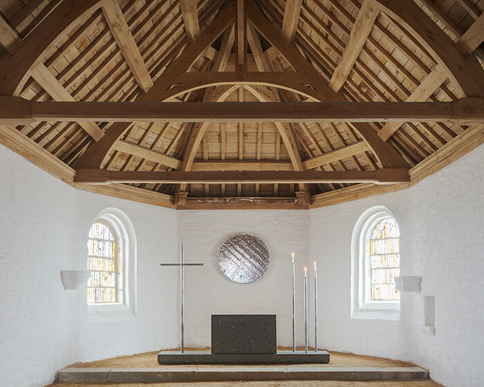 ronan bouroullec adorns restored chapel in monts d'arréel with minimal stone-sculpted altar