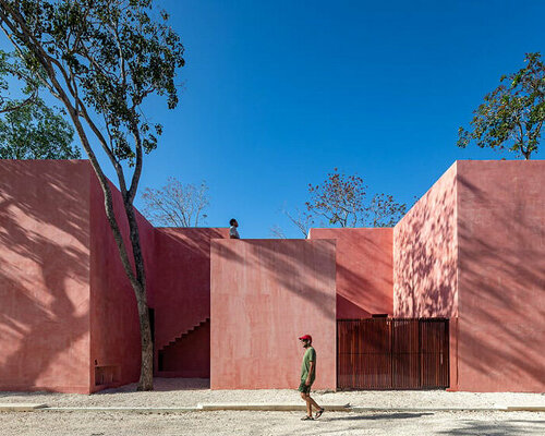 cluster of red volumes woven with green pockets compose coyote arquitectura's tulum home