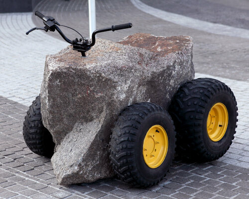 baptiste debombourg carves granite into jet ski and all-terrain vehicle sculptures in quebec